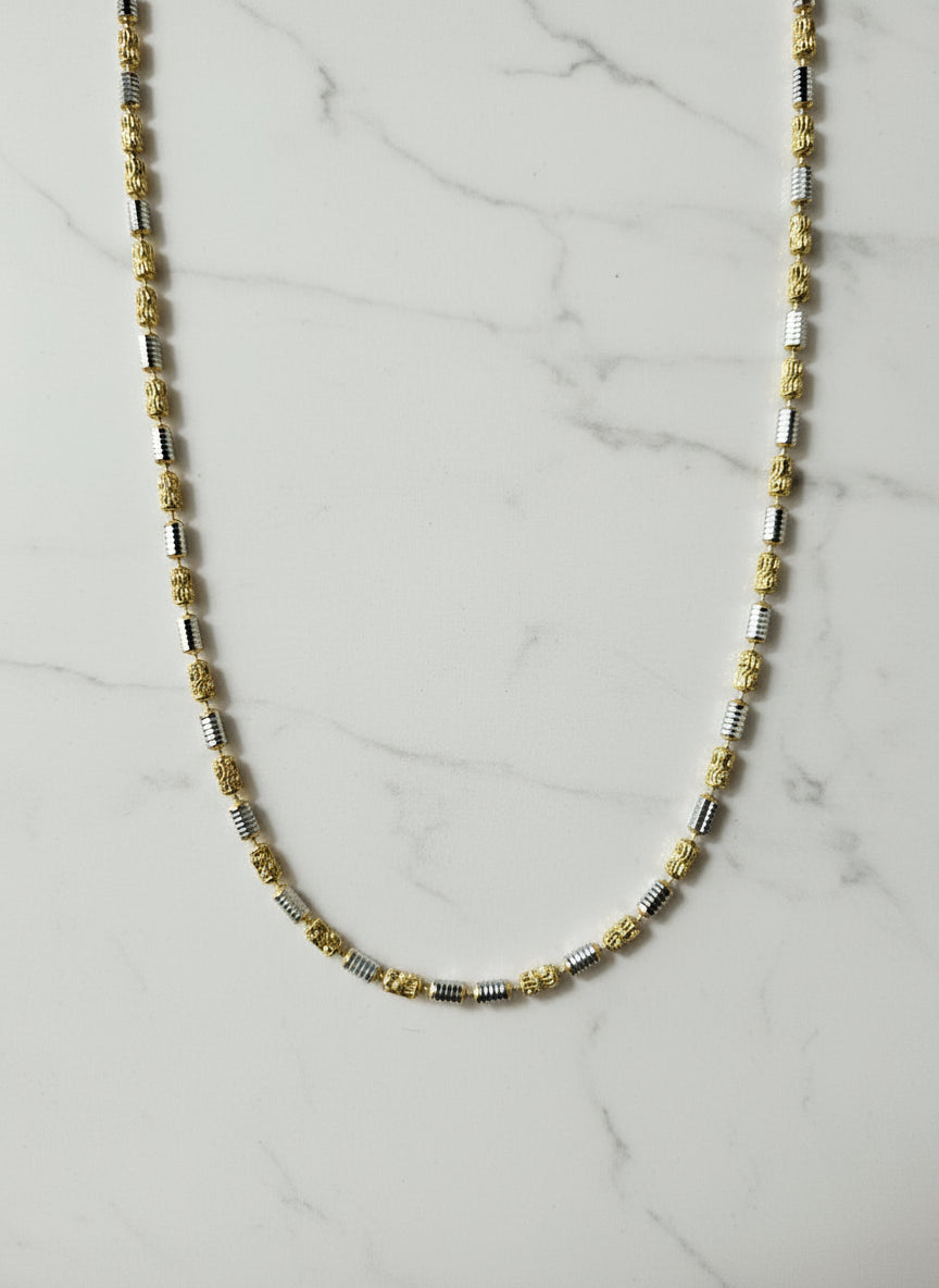 Beaded necklace on a marble surface