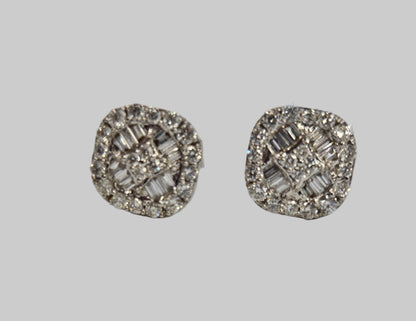 Pair of silver earrings with gemstones on a light gray background